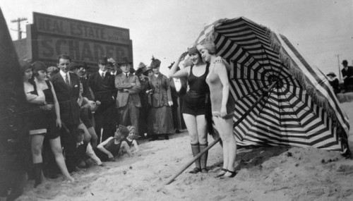 Two women on the beach posed