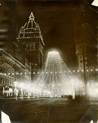 [Nighttime view of Knights of Pythias decorations and Spreckels Building on Market Street]