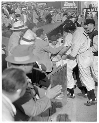 [Several San Francisco Seals players standing near the Seals' dugout]