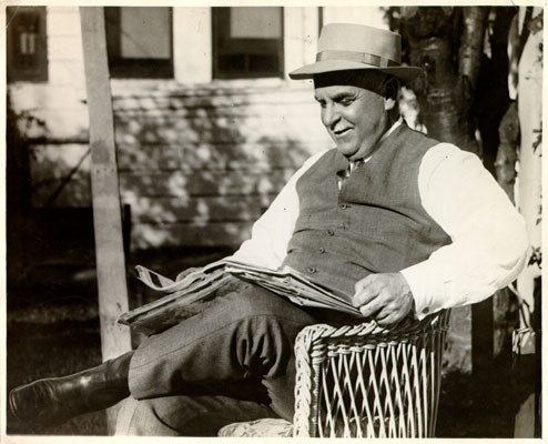 [Mayor James Rolph, Jr. reading a newspaper]