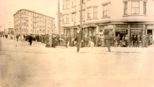 [Refugees standing in a food line]