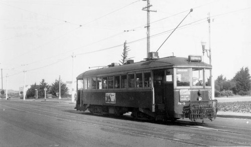 ["L" streetcar heading west on Taraval Street at 36th Avenue]