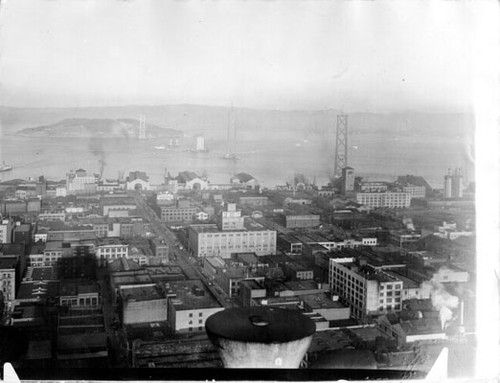 [View of Bay Bridge towers under construction and Yerba Buena Island]