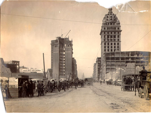 [Small businesses on Market Street, between 3rd and 4th streets, opened after the earthquake and fire of 1906]