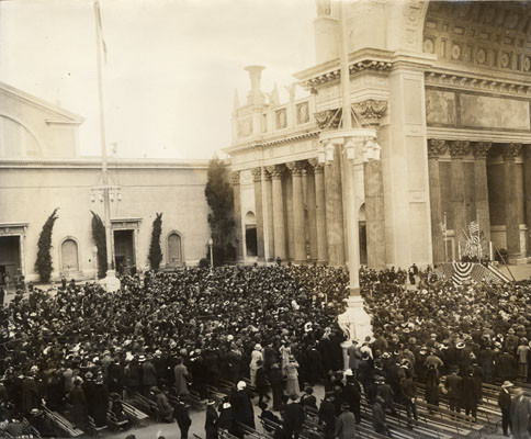 [Speakers stand under Tower of Jewels on Dedication Day]