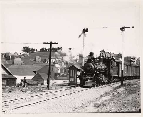 [Railroad train passing the Bernal Cut]