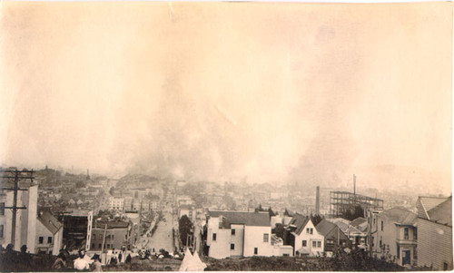 [Group of people on an unidentified hill watching downtown San Francisco burn]