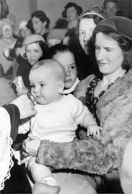 [Baby being blessed at St. Anne's Church]