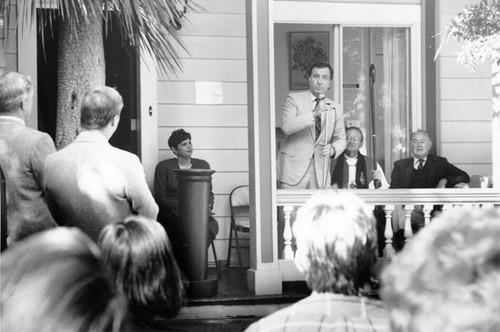 [Art Agnos speaks outside of the Henry Ohlhoff House]