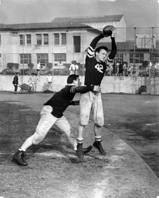 [Al Belcher tackling Wes Russell on the football field of Balboa High School]