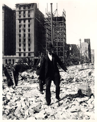 [People walking across rubble near the St. Francis Hotel]