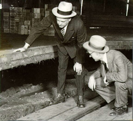 [Two men inspecting a Pier at China Basin]