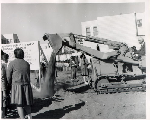 [Mayor Shelley operating machinery on the future site of the Excelsior Library]