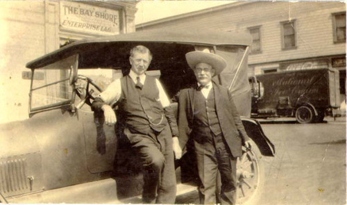 [Two unidentified men standing in front of The Bay Shore Hotel at Leland Avenue and San Bruno Avenue in Visitacion Valley]