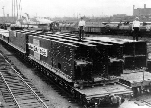 [Steel parts of Golden Gate Bridge on railroad flatcars prior to shipment west]