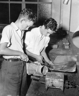 [Students learning sheet metal work at James Denman Jr. High School]