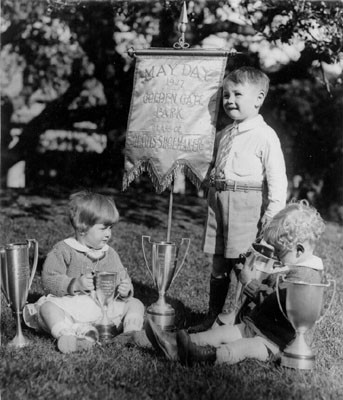 [Three children in Golden Gate Park on May Day in 1927]