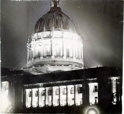 [City Hall at night ablaze with lights]