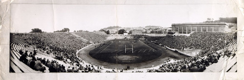 [Crowd of people watching a football game at Kezar Stadium]