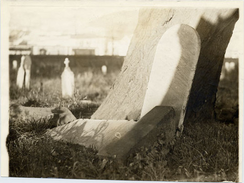 [Overturned gravestones at Laurel Hill Cemetery]