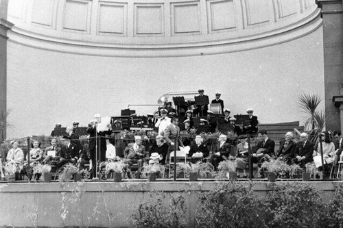 [Bandshell stage full of people during Earthquake Day in Golden Gate Park]