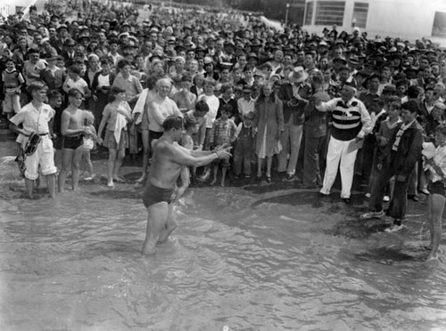 [Byron Summers takes a Harbor Day swim at Aquatic Park]