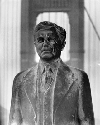 [Statue of Joseph B. Strauss with the Golden Gate Bridge in the background]