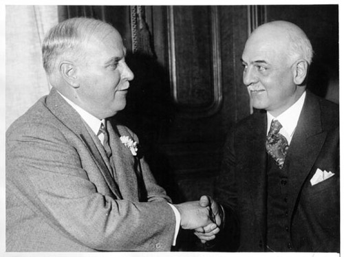 [Governor elect James Rolph, Jr. shaking hands with incoming mayor of San Francisco Angelo J. Rossi]