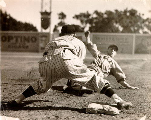 [Dario Lodigiani of the Oakland Oaks sliding into 3rd base during a game with the San Francisco Seals]