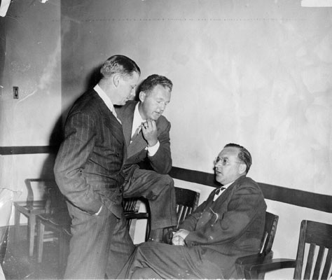 [District Attorney Edmund G. Brown (right) with L. R. Norman (left) and Marshall Leahy]