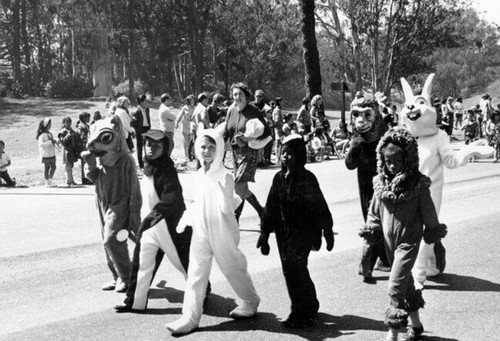 [Children dressed in animal costumes marching in the Golden Gate Park Centennial Parade]