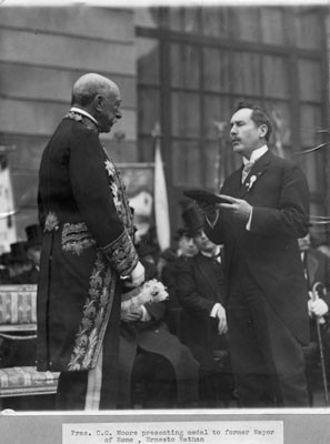 [President C.C. Moore presenting medal to former Mayor of Rome, Ernesto Nathan]