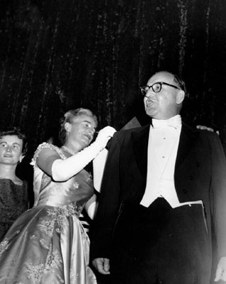 [Mrs. Pat Brown signs autographs on the back of Governor Brown]