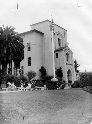 [Several students sitting on benches in front of Balboa High School]