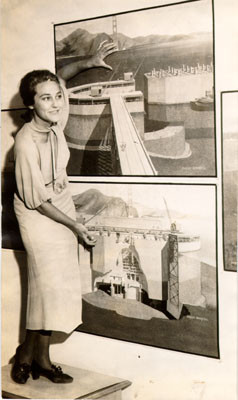 [Eleanor Evans posing with drawings of pier fender used during construction of the Golden Gate Bridge]