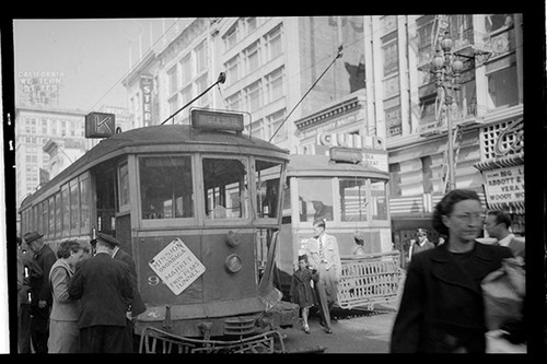 [Scene of a traffic accident involving a MUNI streetcar and MUNI bus at McAllister and Market Street]