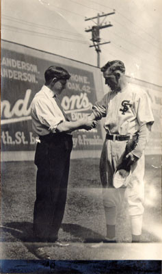 [San Francisco Seals trainer Danny "Doc" Carroll and player Charles Baum at Oakland]