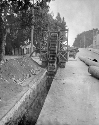 [Trench being dug along the side of Masonic Avenue, near Golden Gate Avenue]