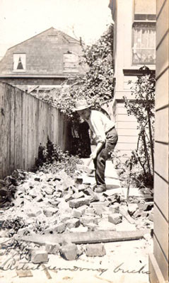 Artist removing bricks