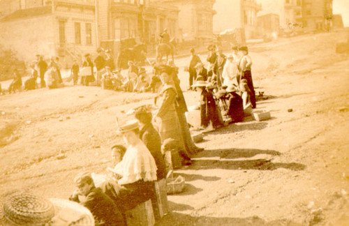 [Refugees waiting in a food line]