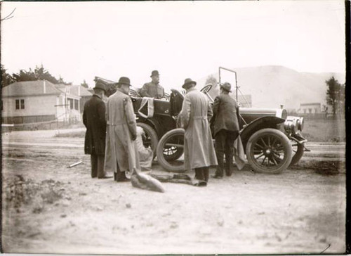 [Group of unidentified men with an automobile]