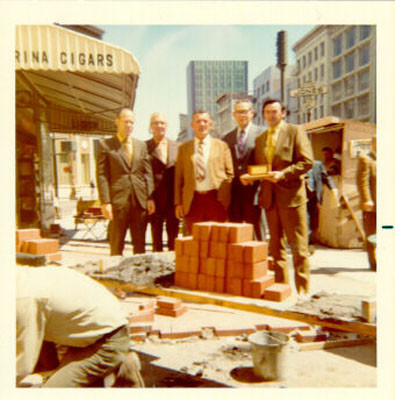 [Jack Barron, Sid Haag, Chris O'Callaghan, Bill Reedy, and Pat Canavan standing together on Market Street at Jones]