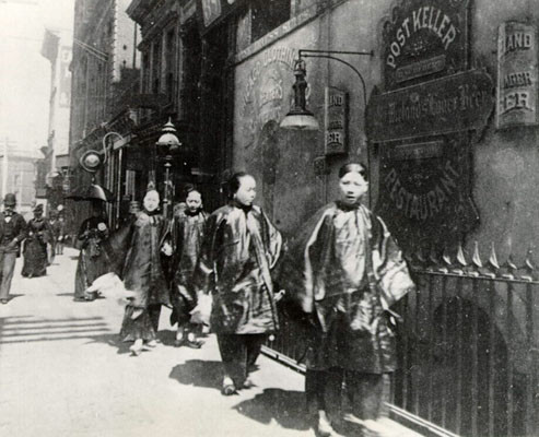 [Chinese women strolling down street in Chinatown]