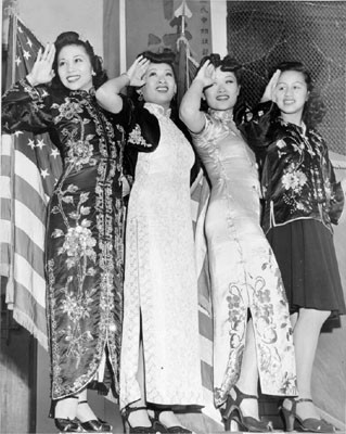 [Female entertainers saluting to a crowd of service men in Chinatown]