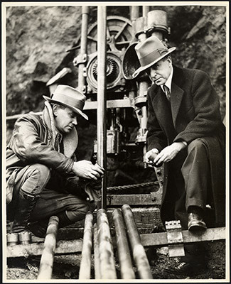 [Joseph Strauss (right) and unidentified person during construction of Golden Gate Bridge]