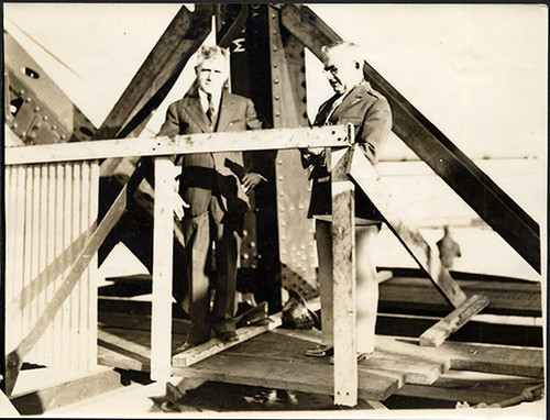 [Joseph Strauss (left) and Major Thomas L. McKenna, Catholic Chaplin of Fort Scott on Golden Gate Bridge during construction]