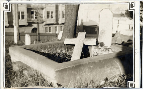 [Fallen gravestone at Laurel Hill Cemetery]