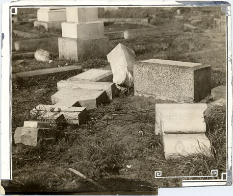 [Overturned gravestones at Laurel Hill Cemetery]