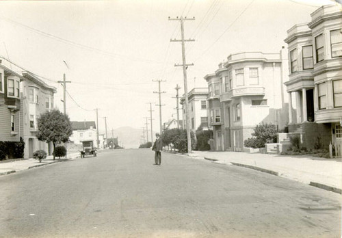 [Man standing on 25th Avenue between California and Lake]