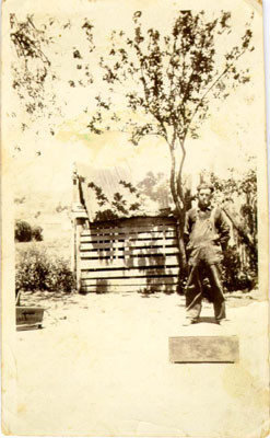 [Man standing in a garden in Visitacion Valley]